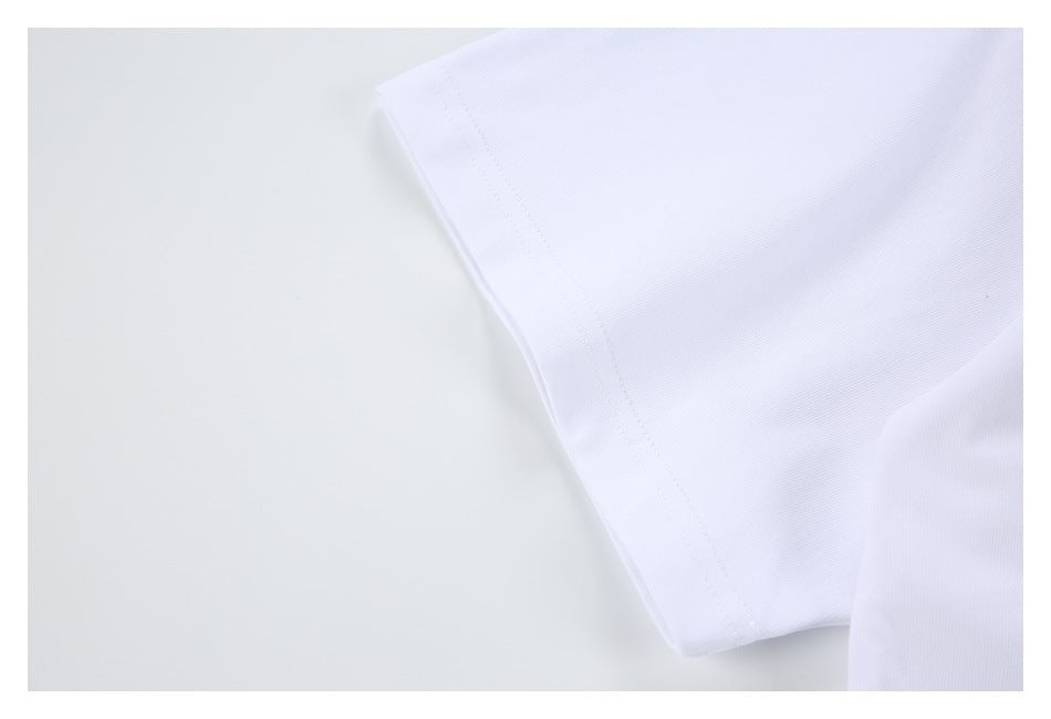 Close-up of a white garment edge with a neat stitched seam.