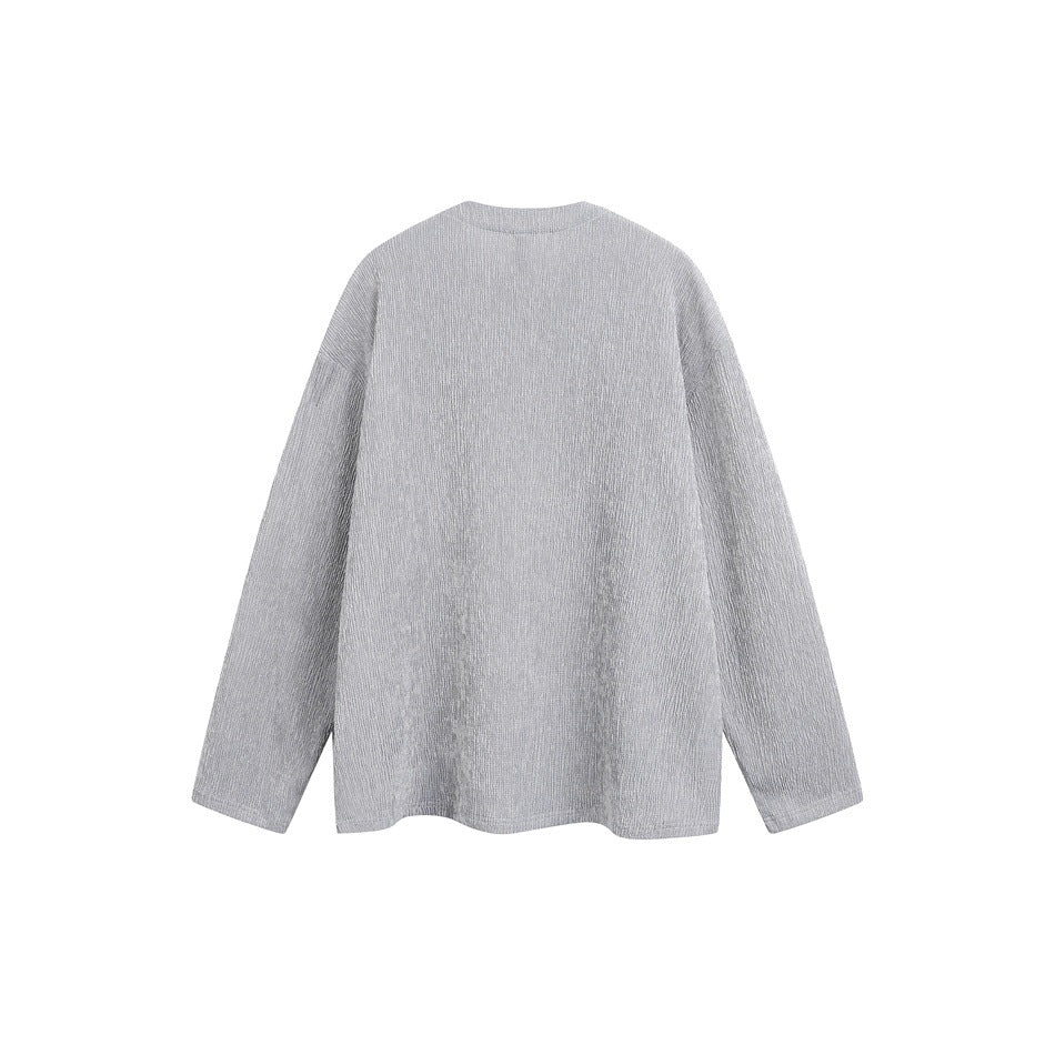 Back view of a light gray long-sleeve top with a round neckline and relaxed fit.