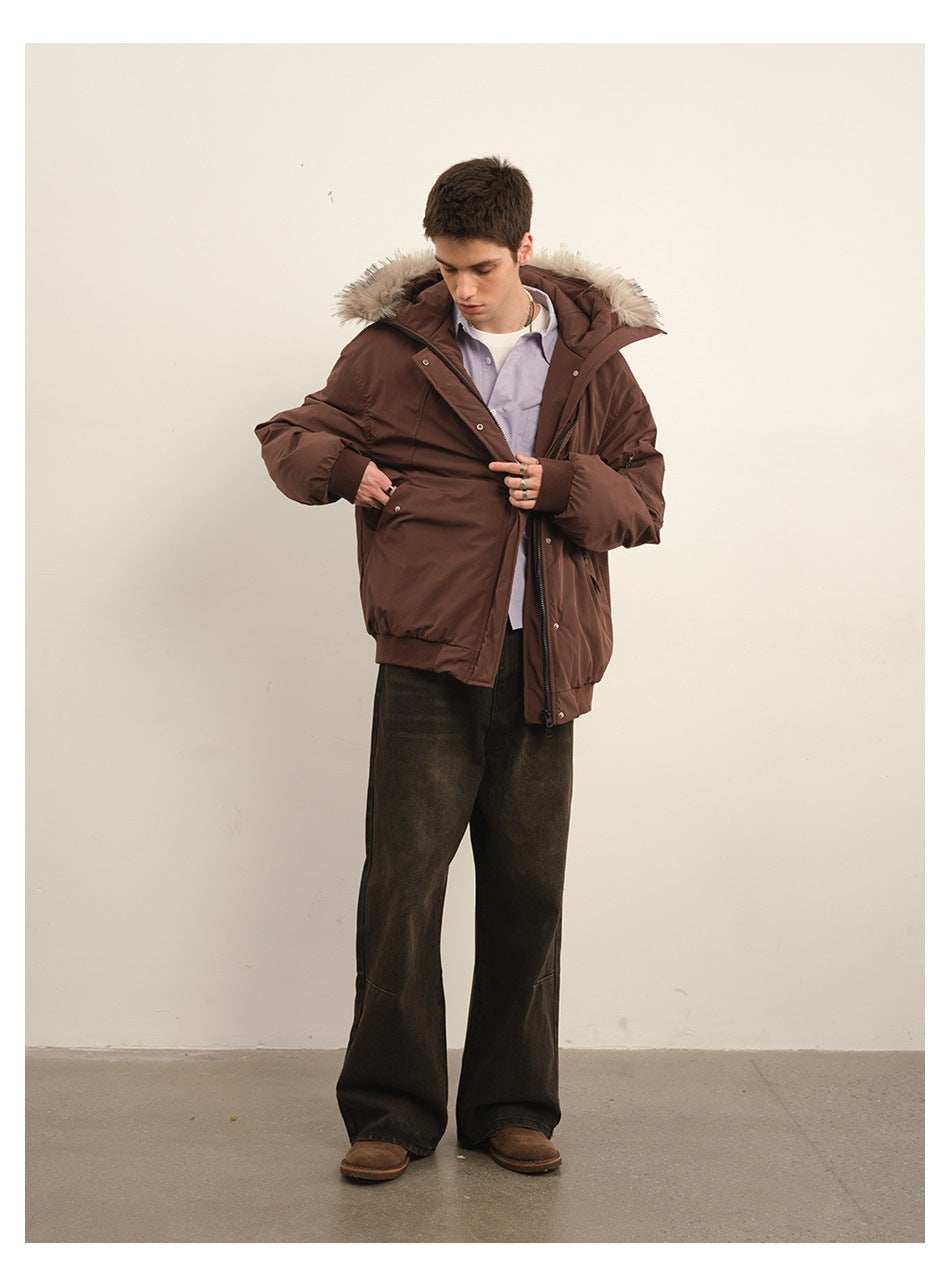 Man models a dark brown fur-trimmed hooded jacket, holding it open to show the front pockets.