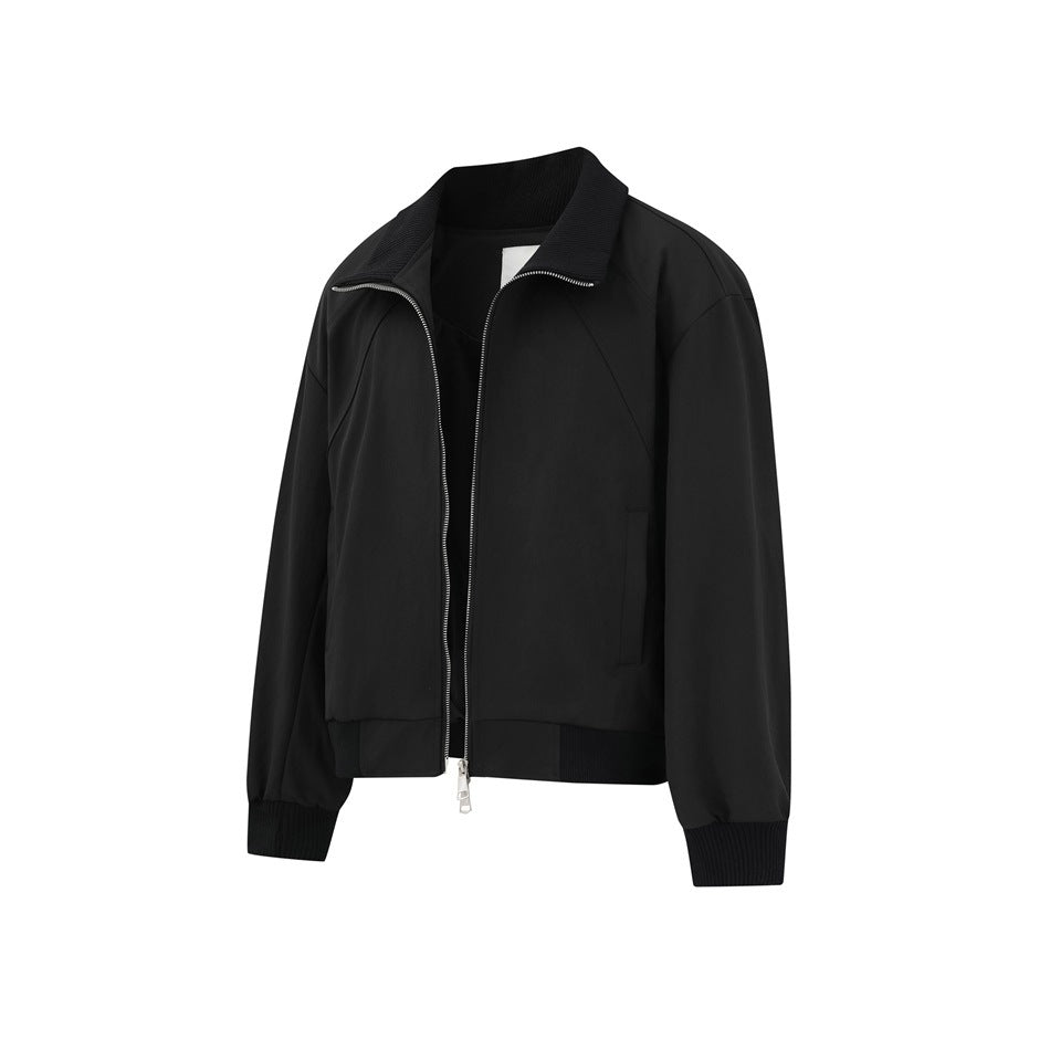 Front view of a black zip-front jacket with a ribbed stand collar, cuffs, and hem.