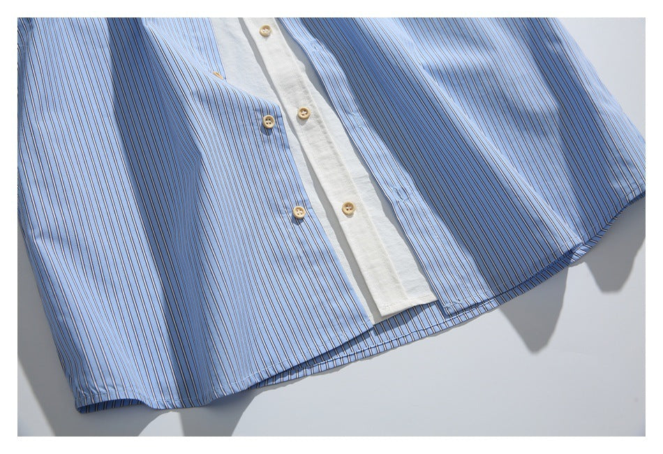 Cropped front view of a light blue striped button-up shirt with a white placket and tan buttons.