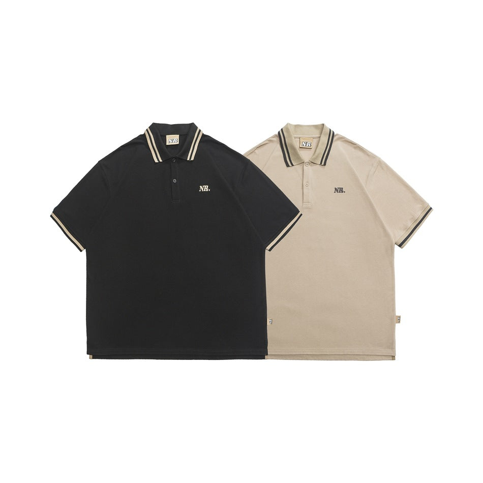 Front view of black and beige short-sleeve polo shirts with striped collars and sleeve trim.