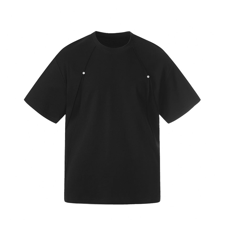 Black short-sleeve crew-neck T-shirt with curved front seams and two small metal studs on the chest, flat front view