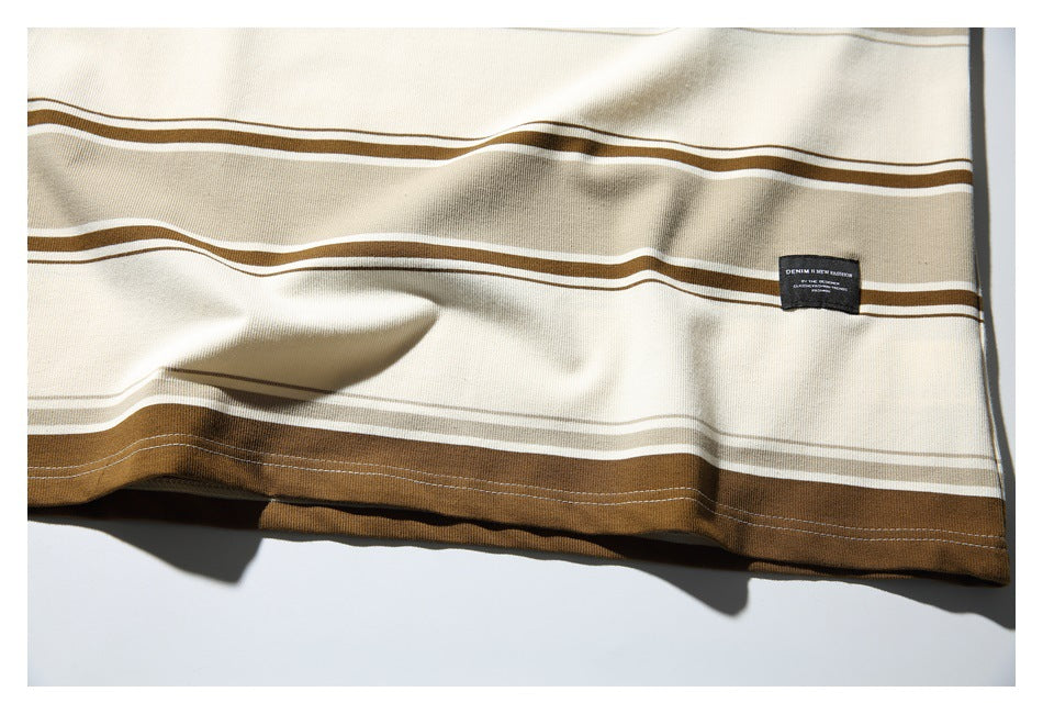 Cream fabric with horizontal brown and white stripes and a small black sewn-on label.