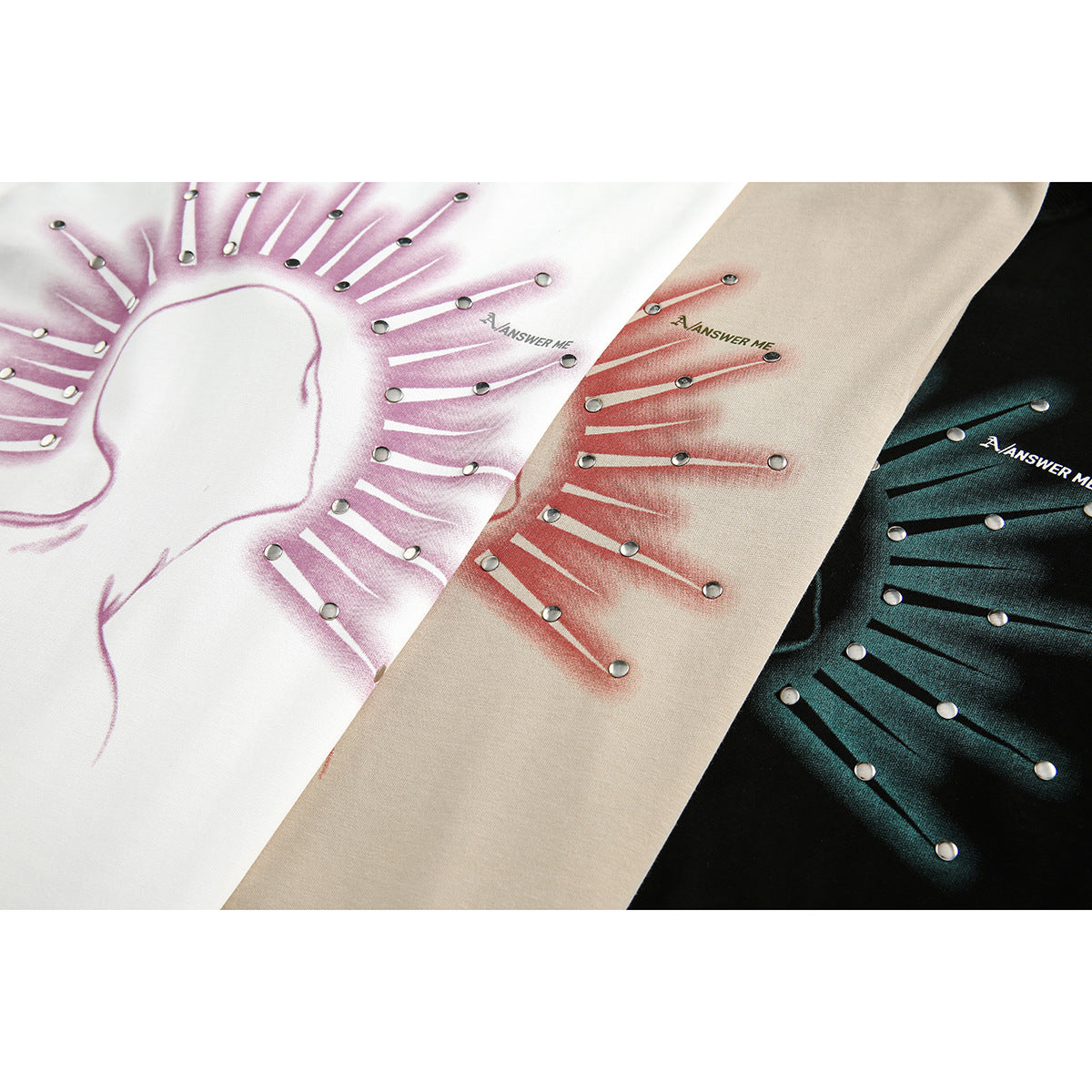 Close-up of three T-shirt colorways with radiating line graphics, metal studs, and small lettering.