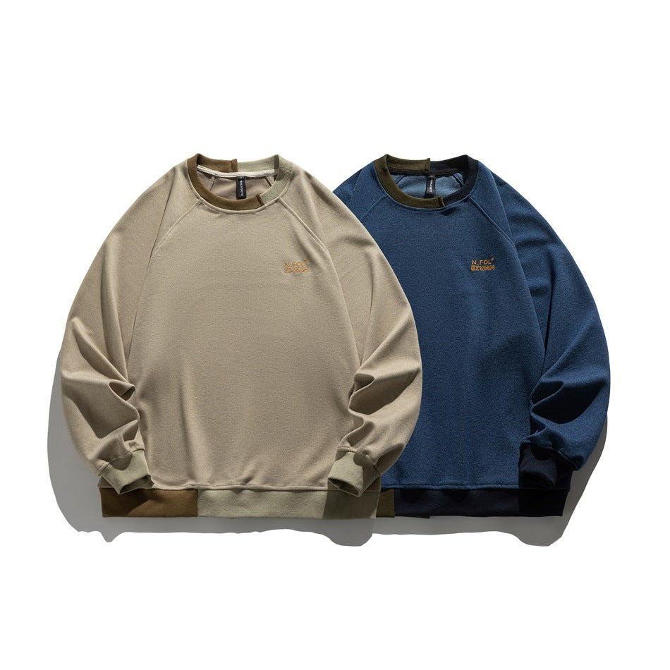 Two crewneck raglan sweatshirts shown flat: one beige and one navy, both with contrast ribbed trim.