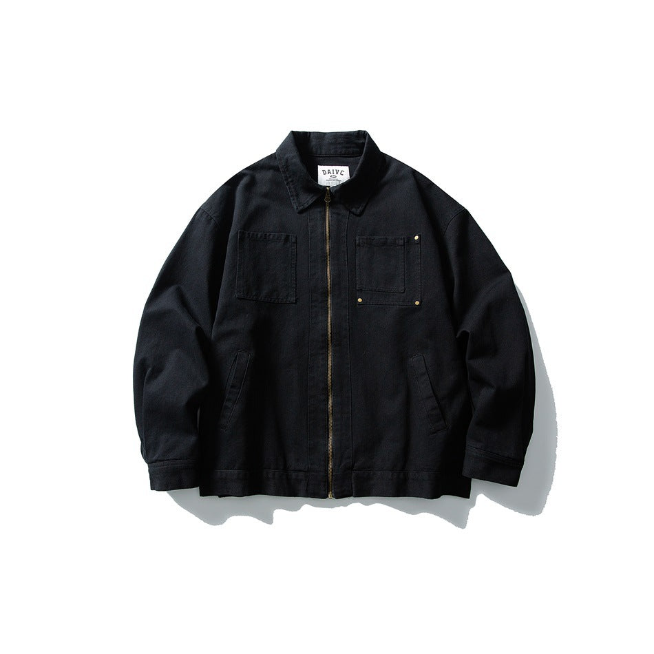 Black zip-front jacket with pointed collar, two chest patch pockets and gold-tone zipper, flat front view