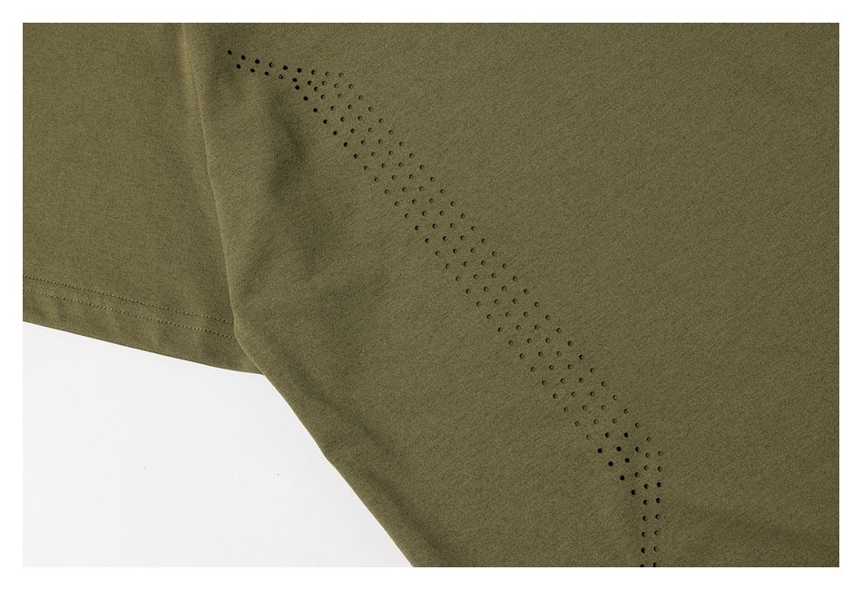 Close-up of rows of small perforations on the olive-green shirt near a seam.