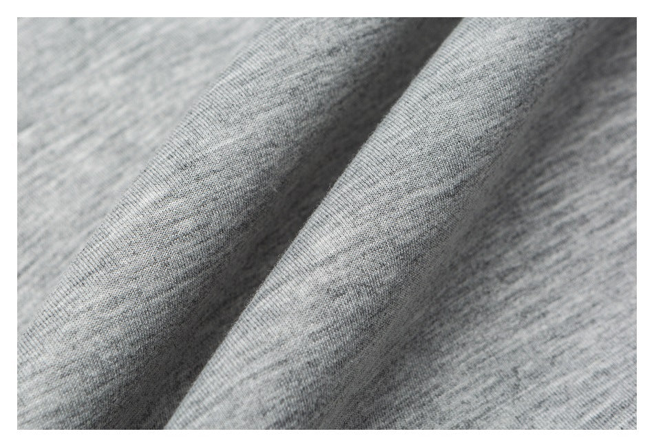 Macro view of the heather-gray fabric texture and drape.