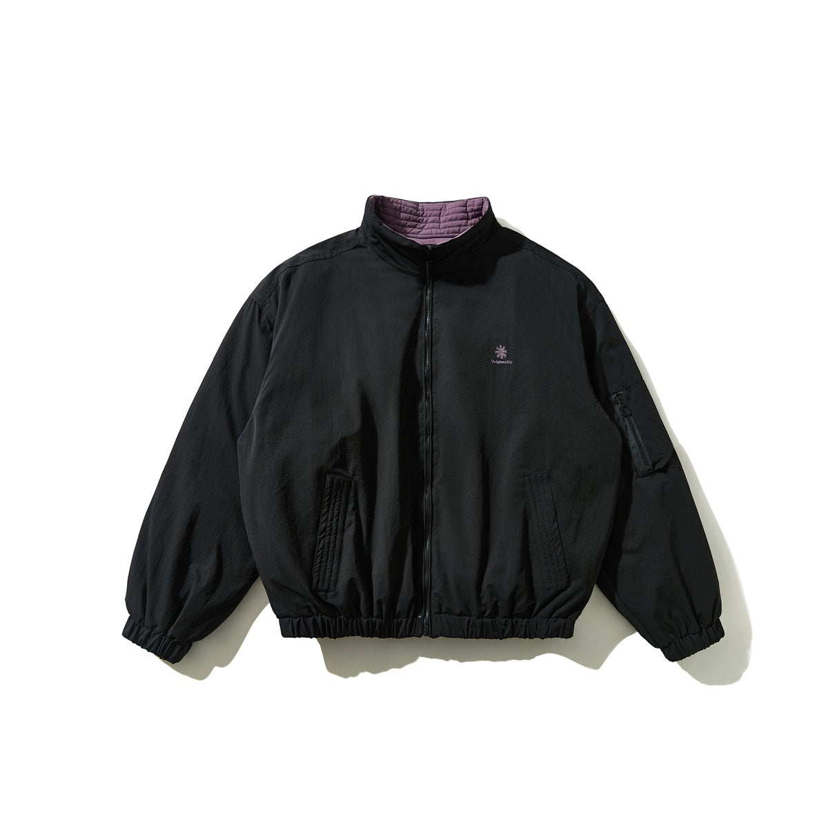 Black stand-collar zip jacket flat lay with purple quilted collar lining, small chest embroidery and sleeve zip pocket