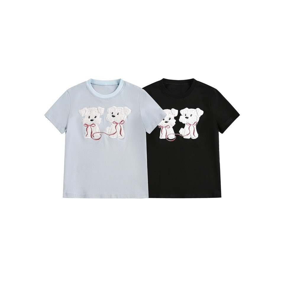 Front view of pale blue and black short-sleeve crew-neck T-shirts with matching white teddy bear appliqués.