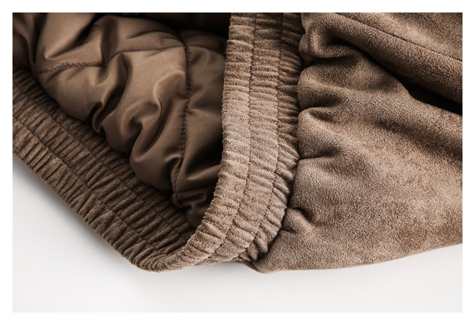 Inside close-up of the brown jacket showing its gathered ribbed edge and smooth lining.