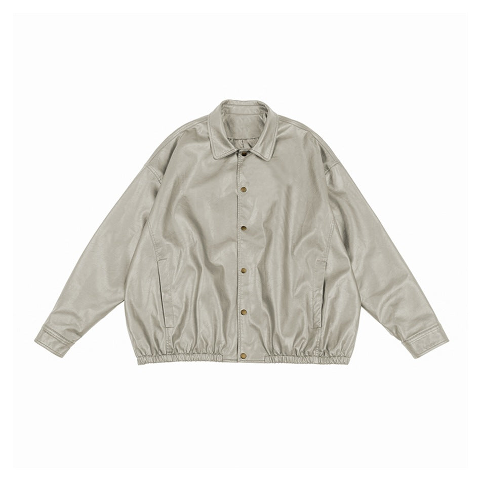 Light gray faux leather jacket flat lay with collar, snap buttons, side pockets and elastic hem