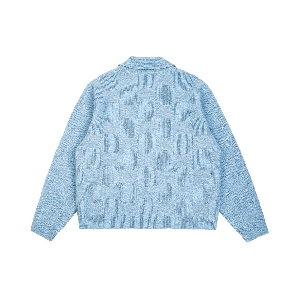 Back view of blue knit cardigan with collar and checkerboard-style textured pattern