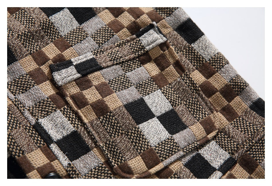 Close-up of a patch pocket on a brown, tan, gray, and black check shirt.