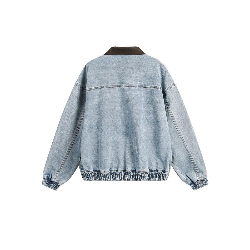 Back view of a light blue denim jacket with a dark brown collar and gathered hem and cuffs.