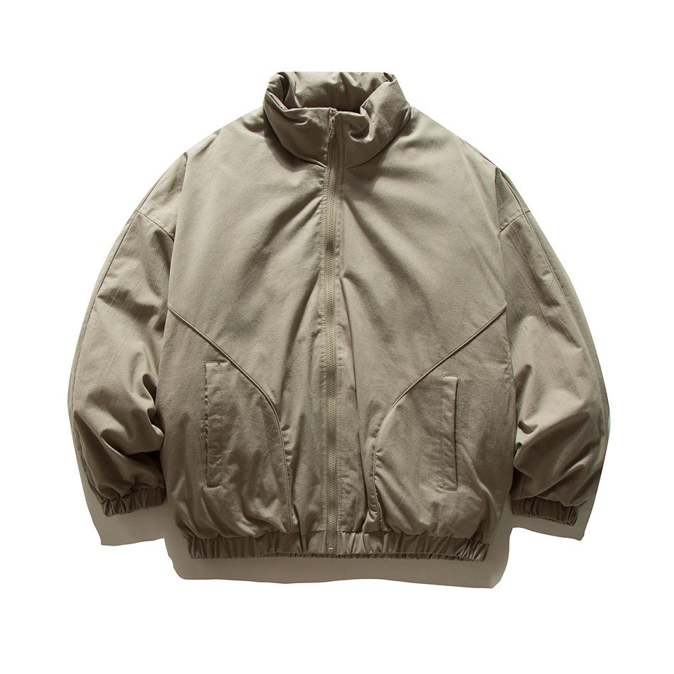 Khaki zip-front stand-collar jacket with curved front seams, slanted pockets and elastic cuffs and hem, flat lay