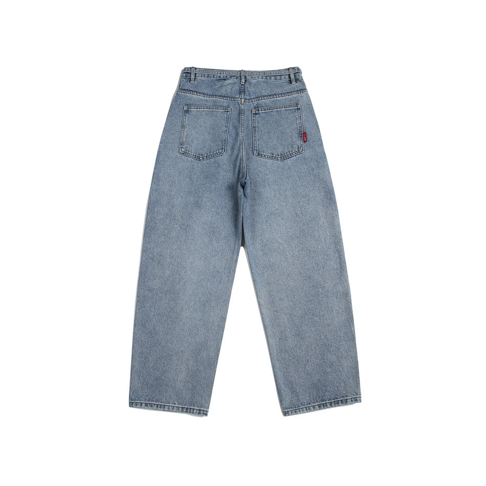 Back view of light-wash, wide-leg jeans with two patch pockets and a small red pocket tab.