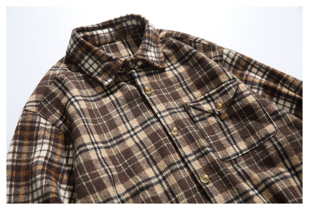 Brown and cream plaid button-up shirt laid flat, with a pointed collar, front buttons, and a buttoned chest pocket.