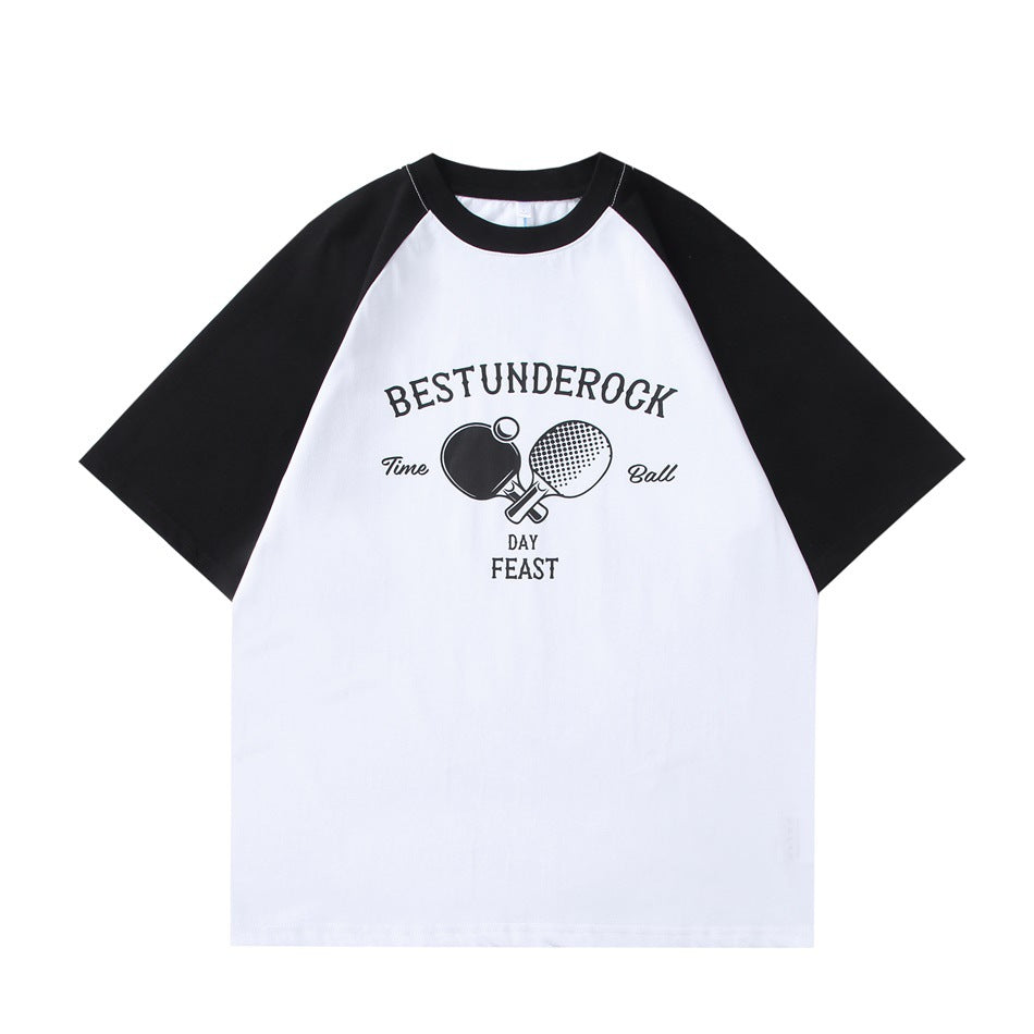 White raglan T-shirt with black sleeves and a front table tennis paddle graphic with BESTUNDEROCK text