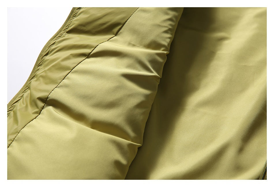 Close-up showing the olive-yellow jacket's padded panels and smooth inner surface.