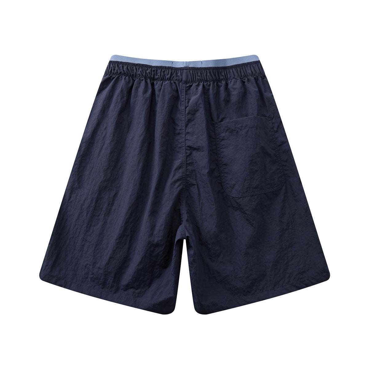 Back view of navy shorts with an elastic waistband and a large patch pocket.