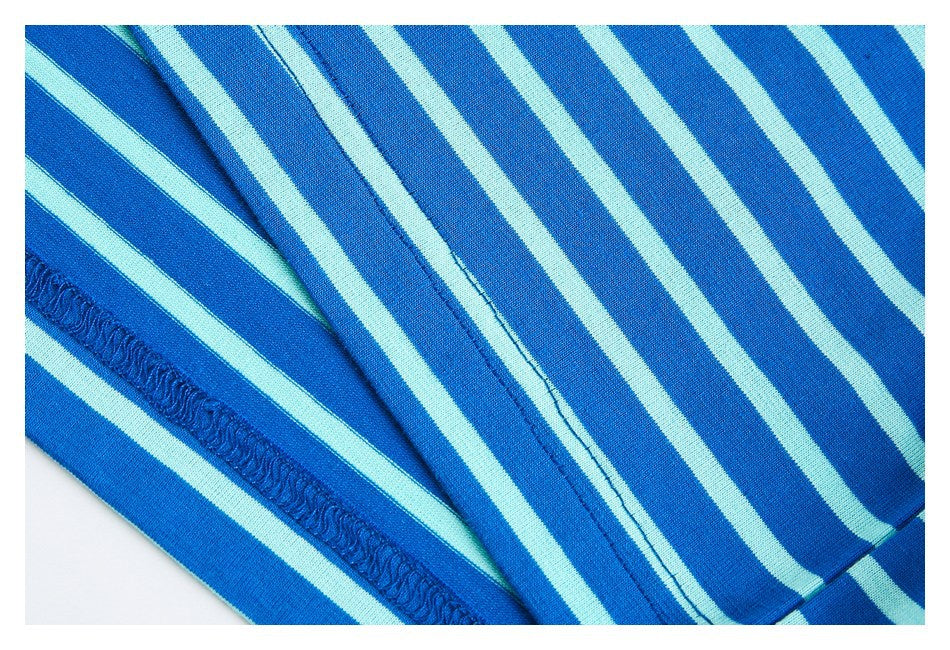 Close-up of blue and pale aqua striped fabric showing garment seams and stitching.