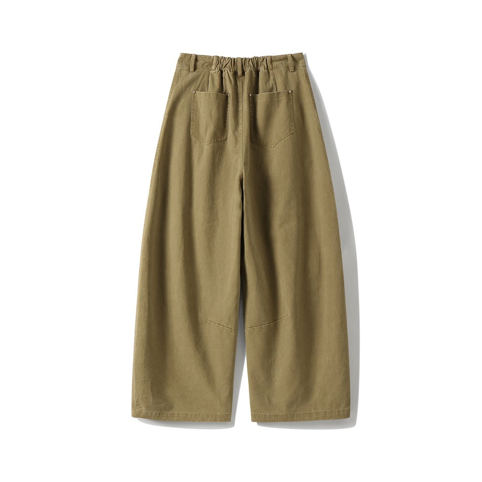 Back view of khaki wide-leg pants showing elastic waistband, two patch pockets with rivets and knee seams