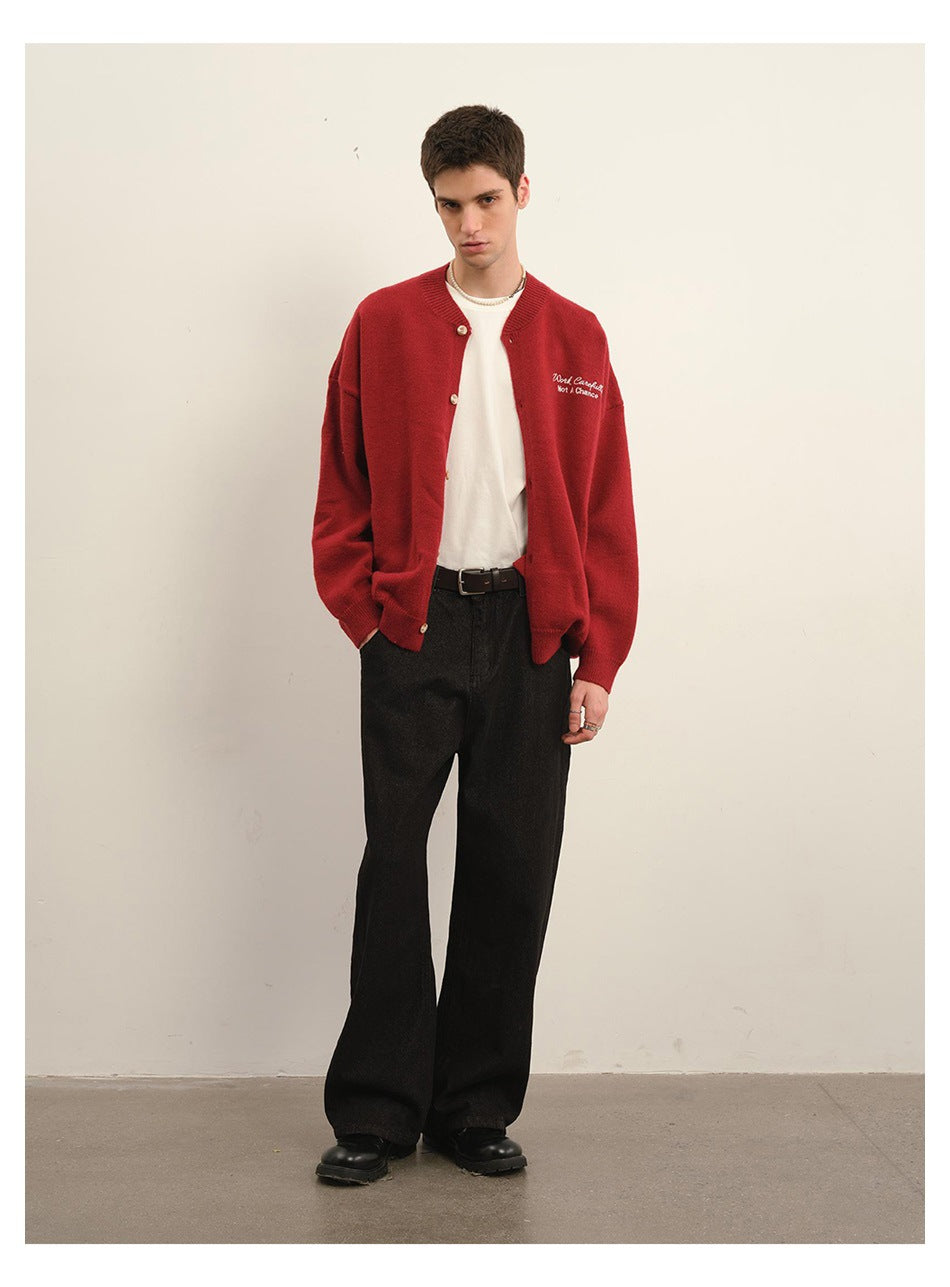 Model wearing a red button-front cardigan with white chest embroidery, shown at a slight angle.