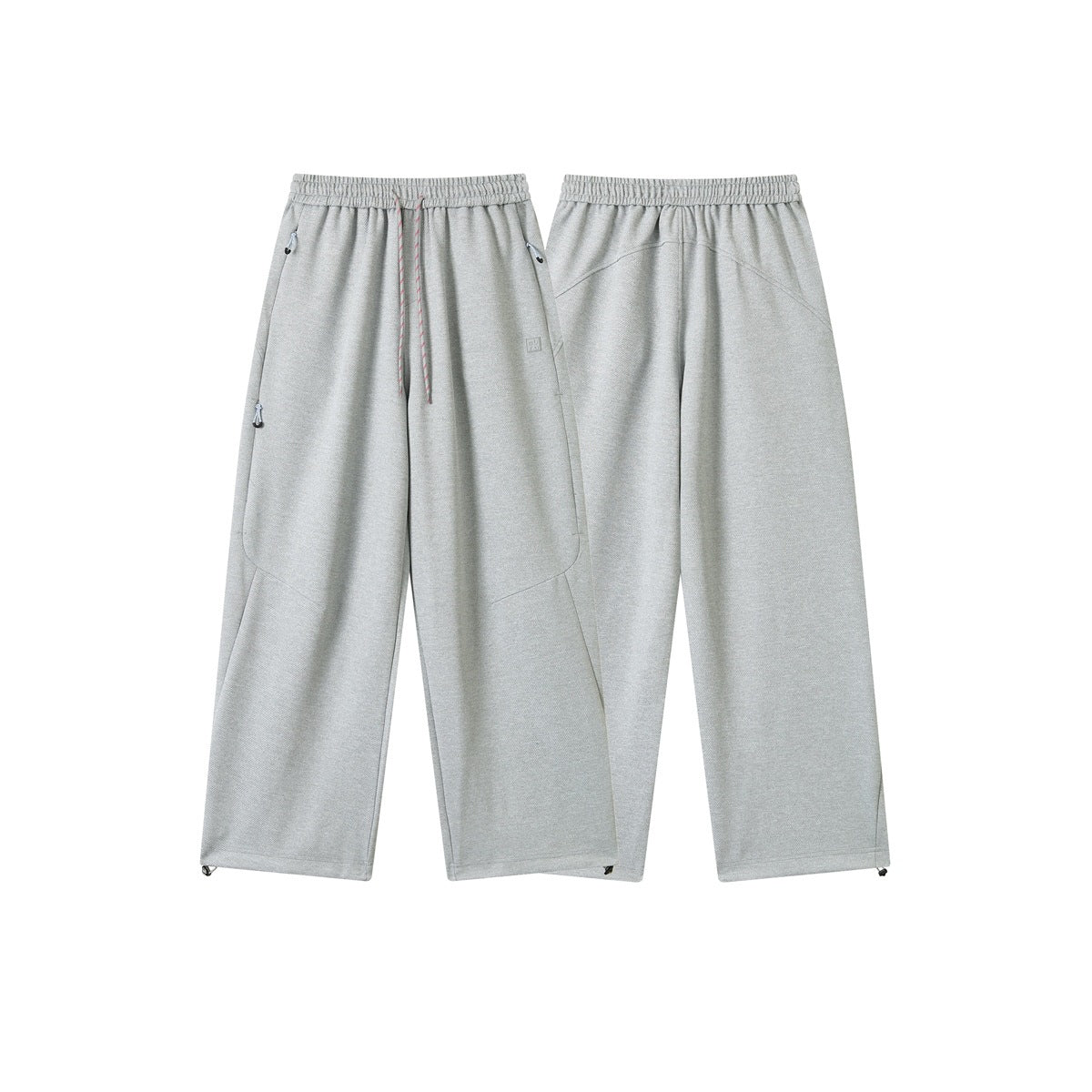 Light gray pants shown from the front and back, with an elastic waist, drawstring, zip pockets, and adjustable hems.
