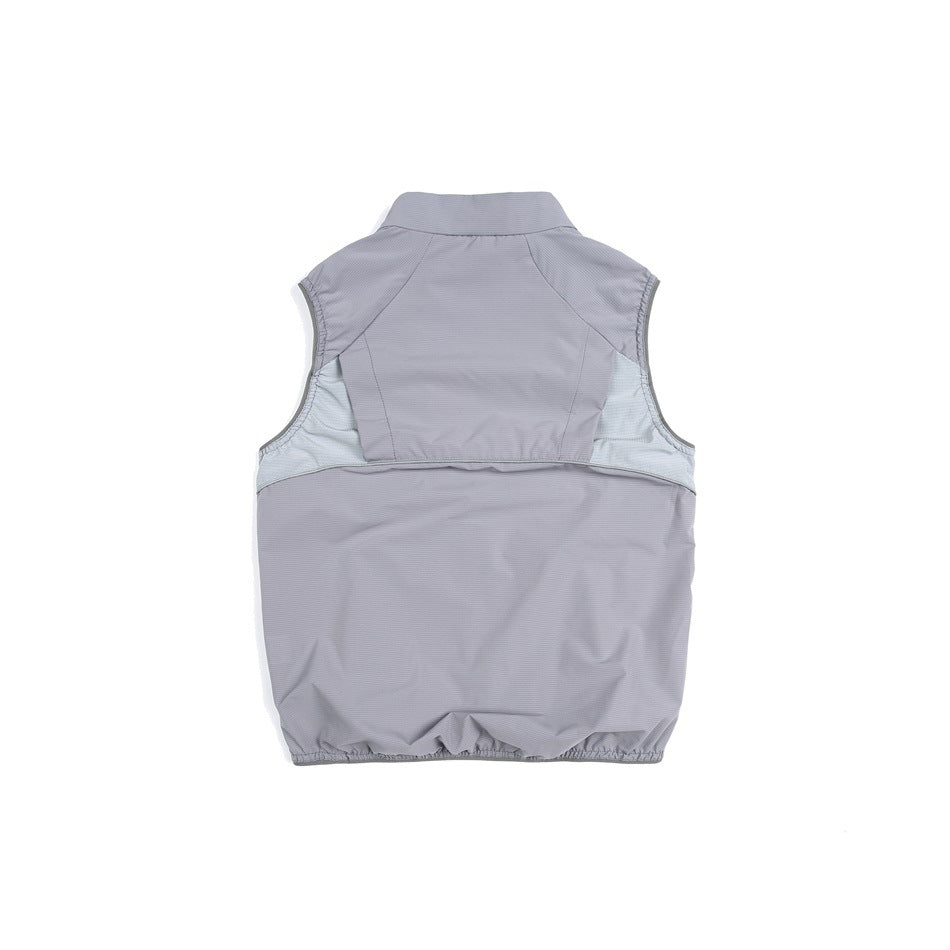 Back view of a gray sleeveless vest with pale side panels and an elasticized hem.