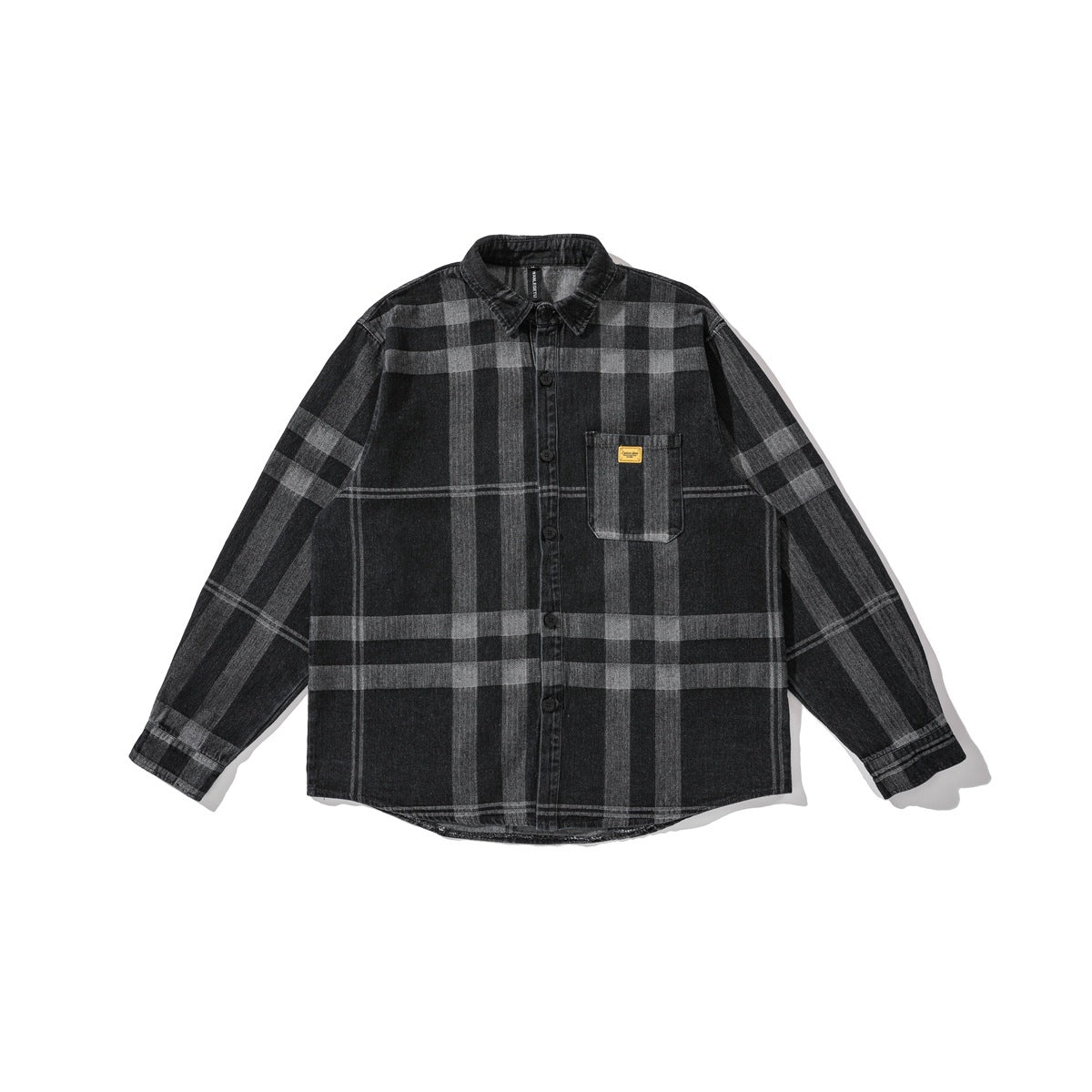 Washed black and gray plaid denim-look long-sleeve button shirt laid flat, with chest pocket and yellow label