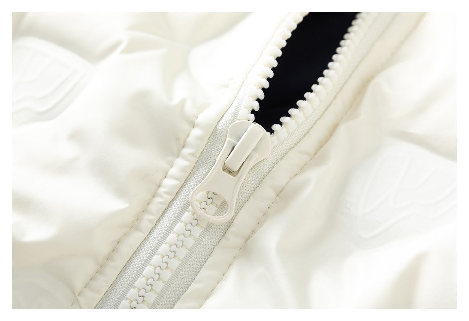 Close-up of the jacket’s chunky white zipper and pull against its subtly patterned fabric.
