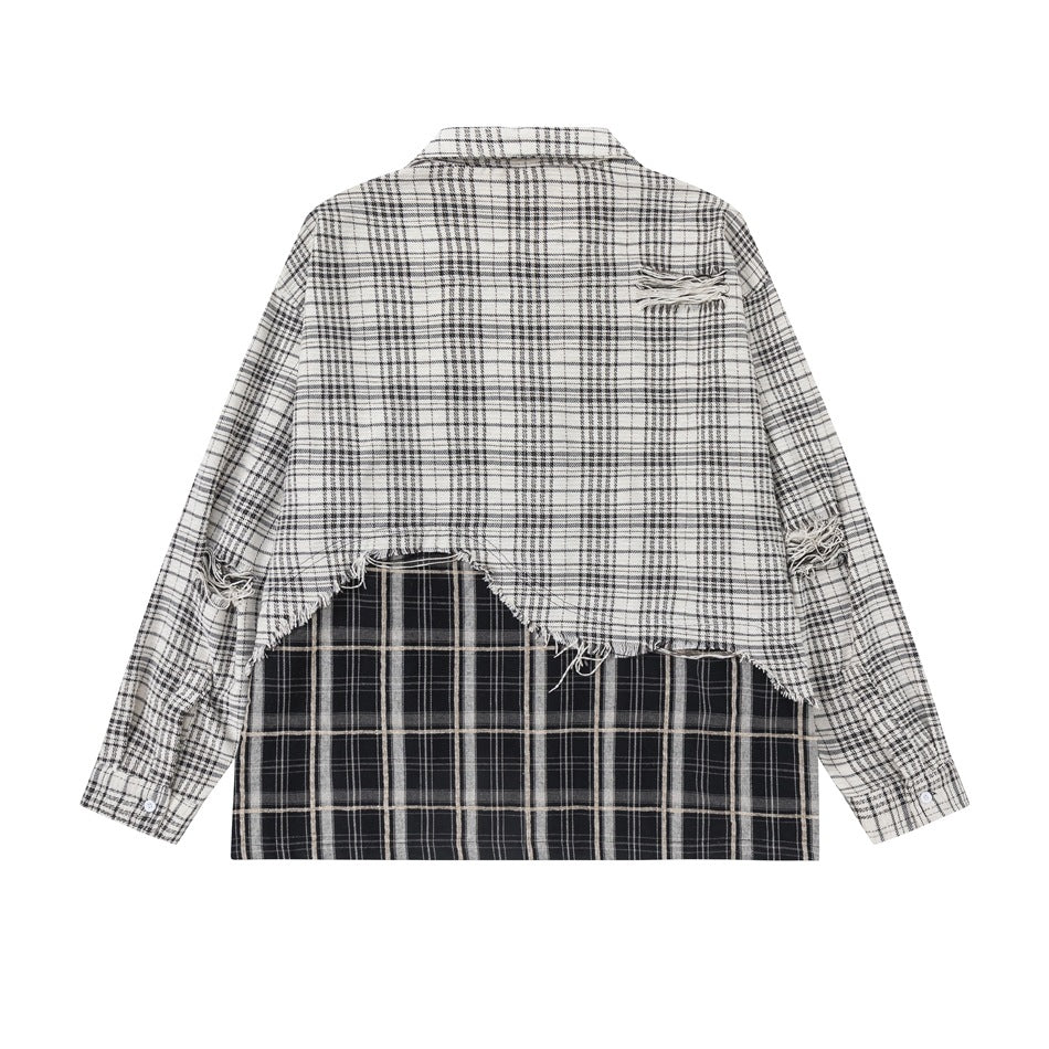 Back view of a black-and-white plaid shirt with a contrasting dark plaid lower panel and frayed details.