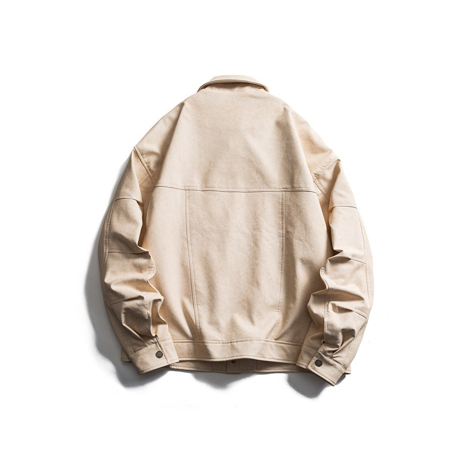 Back view of a beige collared jacket laid flat, showing panel seams, long sleeves, and button cuffs.