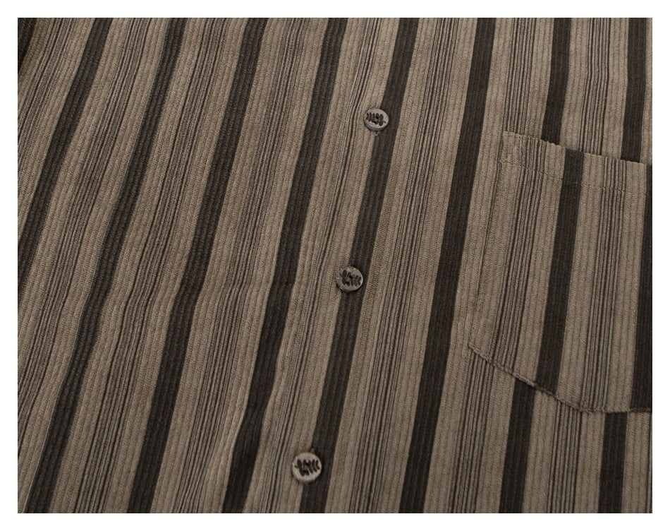 Close-up of the shirt's brown-gray vertical stripes, front buttons, and chest pocket.