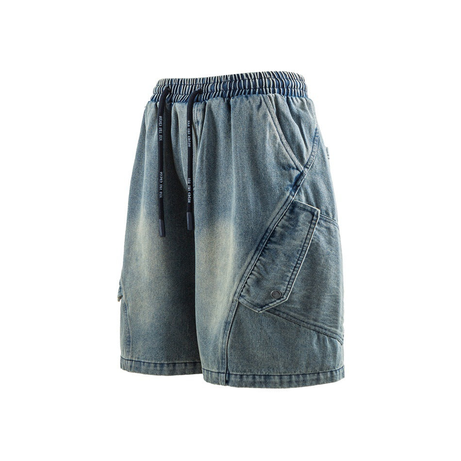 Faded blue denim-look cargo shorts with drawstring elastic waist and large side flap pocket, angled three-quarter view