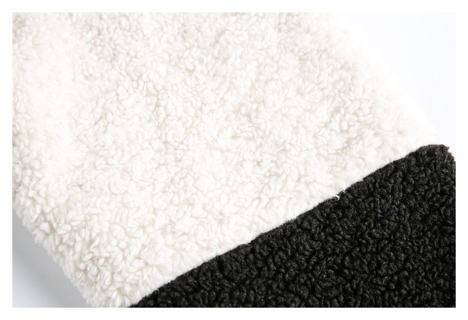 Close-up of cream and black textured fabric panels meeting diagonally.