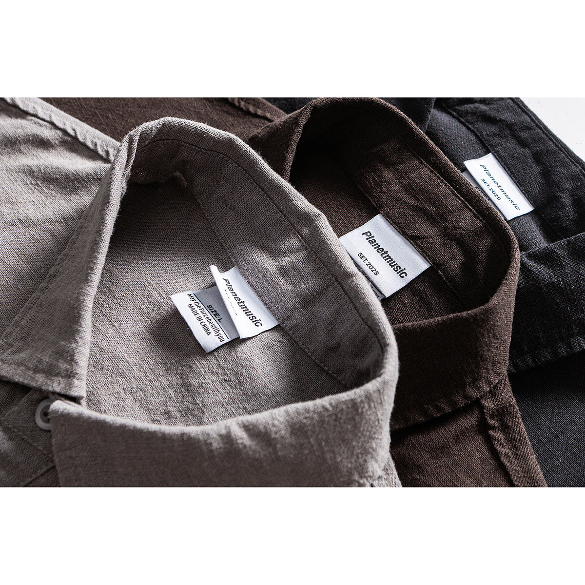 Close-up of gray, brown, and black shirt collars with sewn-in size and brand labels.