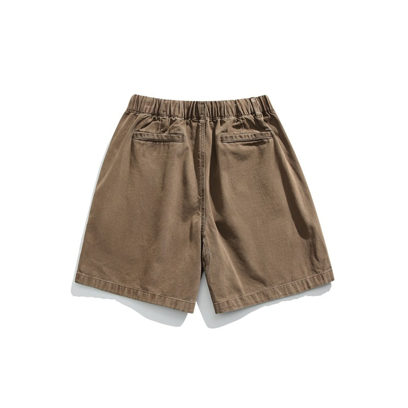 Rear view of brown shorts with an elastic waistband and two back pockets, displayed flat on white.