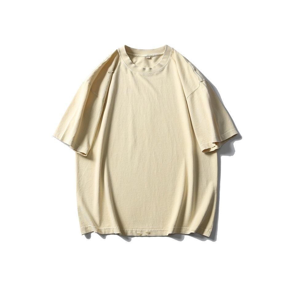 Light yellow distressed short-sleeve crew-neck T-shirt, flat front view on white background