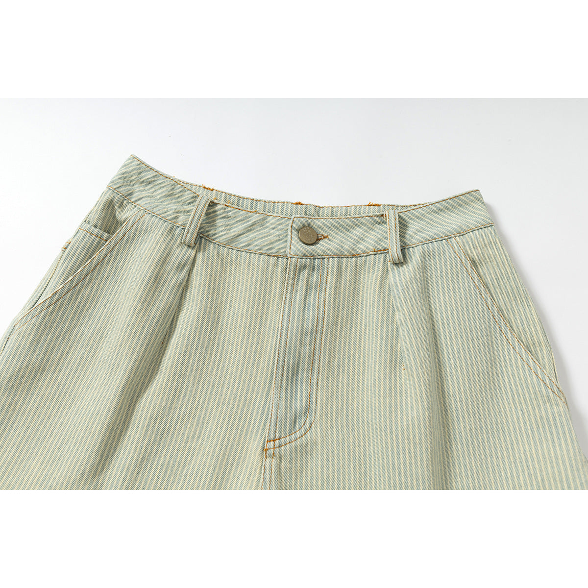 Close-up of pale blue striped shorts showing the waistband, button, belt loops, and front pleats.