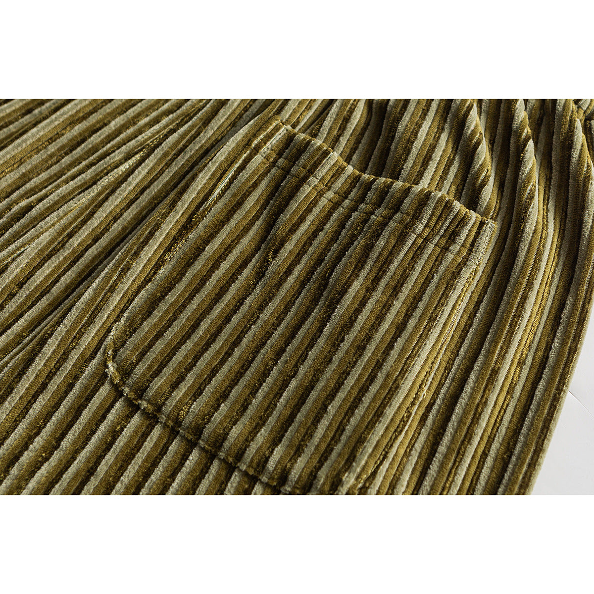 Close-up of a pocket on olive pants with narrow vertical stripes.