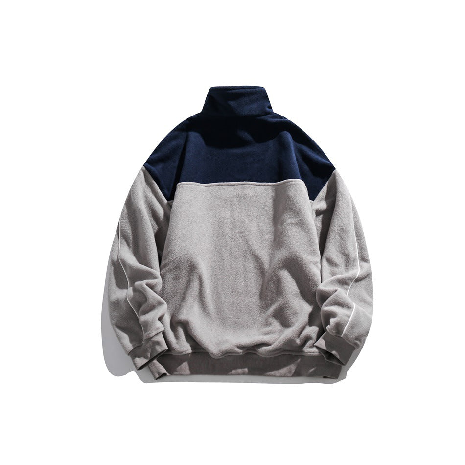 Back view of a light-gray fleece pullover with a navy upper-back panel, tall collar, and ribbed cuffs and hem.