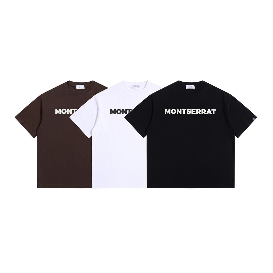 Front view of brown, white, and black short-sleeve T-shirts with MONT SERRAT lettering.