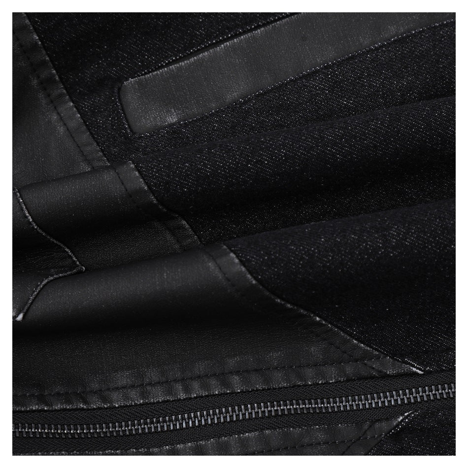Close-up of black jacket panel seams, contrasting textured sections and zipper teeth.