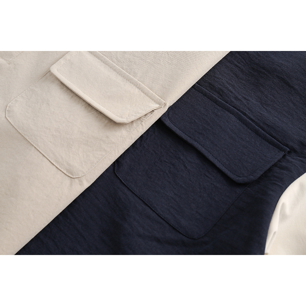 Close-up of stitched patch pockets on beige and dark navy garments.