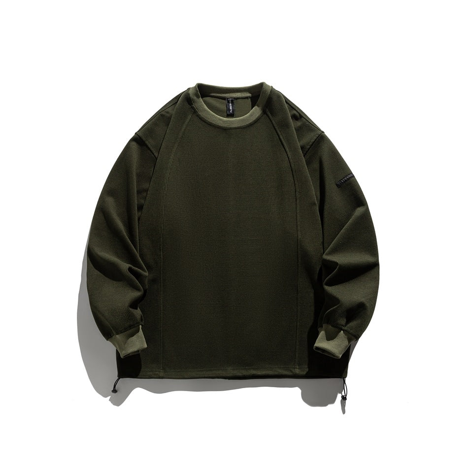 Green crew-neck ribbed sweatshirt flat lay with raglan seams, matching trim and hem drawcord toggles
