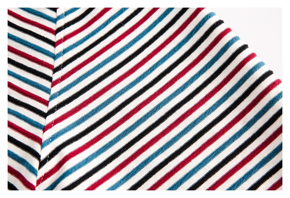 Close-up of the jacket’s striped fabric and seam, showing red, teal, black, and white lines.