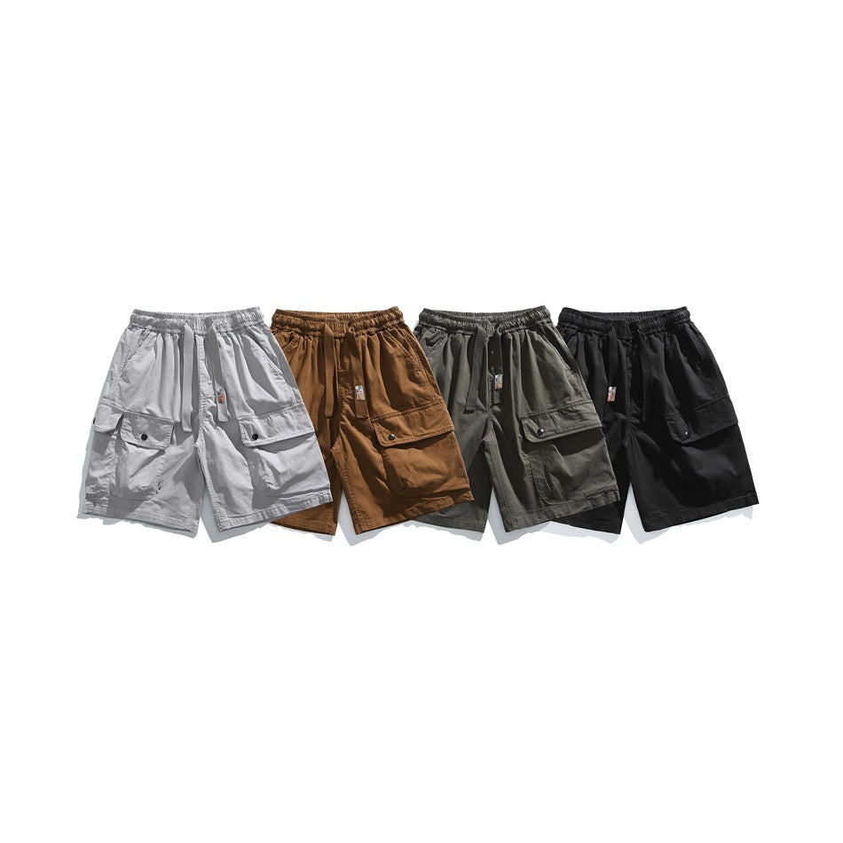 Four cargo shorts arranged together in white, brown, gray-green, and black.